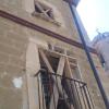 Estat en que es trobava la façana abans d'inicar l'obra de restauració de façana de Cal Negre. Alpicat. Lleida