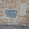 Colocación piedra natural y puerta contador agua