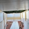 Cerramiento de una terraza con panel sandwich sobre una estructura de madera. Godelleta año 2025