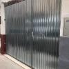 Reforma e instalación de puerta galvanizada