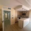 Cocina abierta en U junto al pasillo en un piso reformado en Reus - LUCMAR URBA