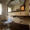 Baño rústico con suelo hidráulico en Montbrió del Camp - LUCMAR URBA