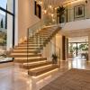 Escaleras interiores: Construcción de escaleras de diseño con iluminación LED integrada, revestimientos premium y barandillas de cristal.